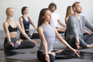 Group of people in same yoga pose